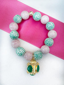 Light of the world lantern charm bracelet in pink & green